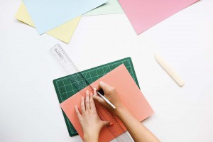 Picture of envelopes and a hands holiding a ruler.
